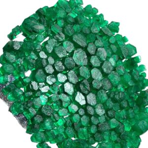 rough emeraldhis rough emerald stone is a natural, uncut gemstone known for its deep green tone and raw beauty. mined from natural sources, it is left in its original form to preserve authenticity and uniqueness. each piece carries natural inclusions and variations that make it one of a kind. rough emerald is widely used for gemstone cutting, jewelry design, and crystal collections. it is valued for its natural appearance and potential to be shaped into high quality polished stones. perfect for jewelers, collectors, and gemstone enthusiasts, this stone offers both aesthetic and investment value. its raw form makes it suitable for custom cutting and creative jewelry crafting projects. stone